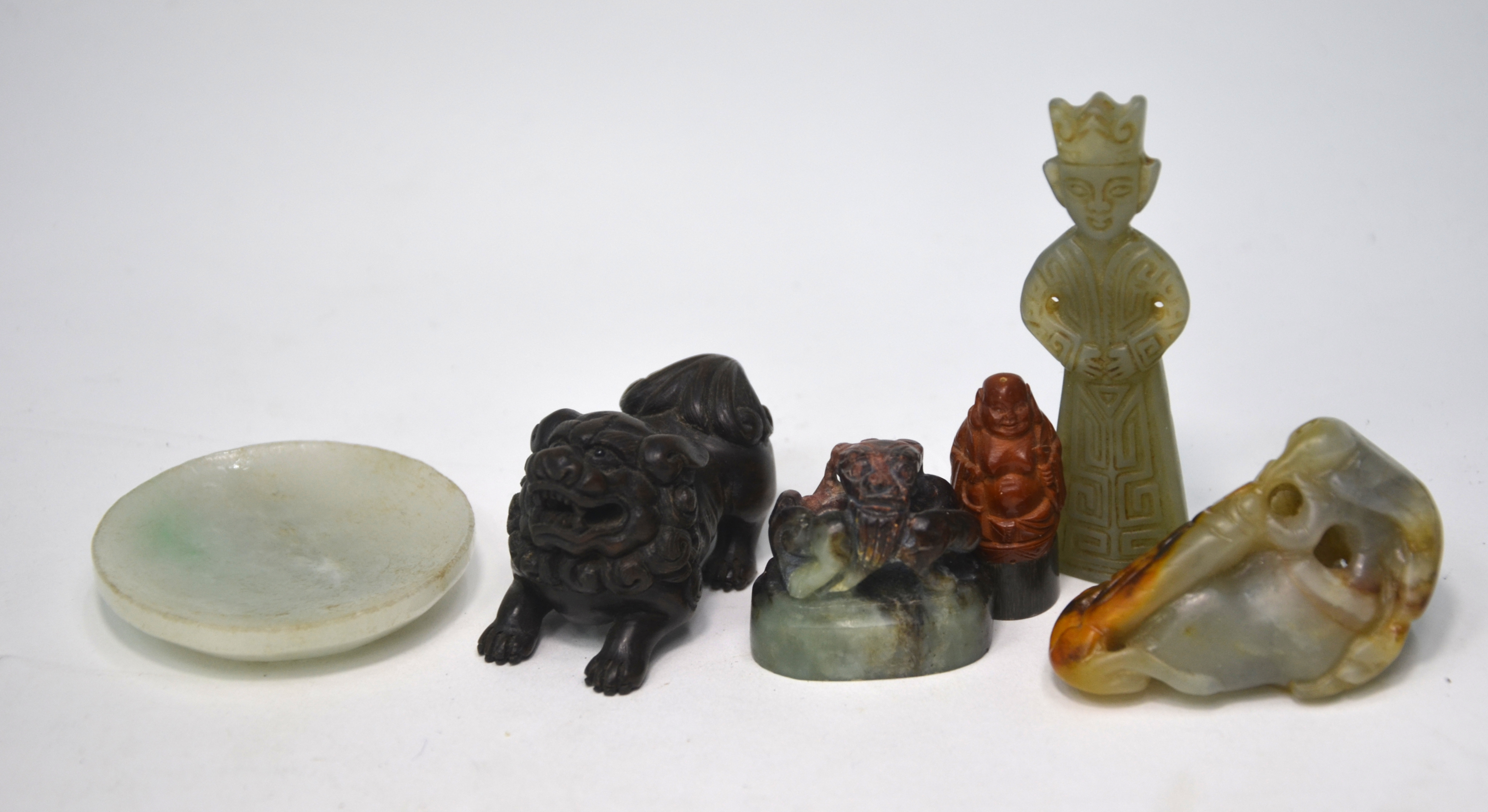 Six small cabinet or scholar's objects, comprising: a wood netsuke of a karashishi; a mottled