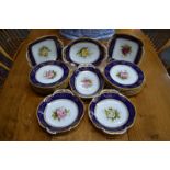 A fine quality Coalport dessert service, each piece painted with a central rose by F Howard within a