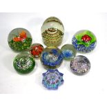 A Caithness glass paperweight 'Myriad', to/w eight other paperweights including specimens,
