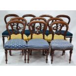 A Victorian set of ten mahogany framed dining side chairs with moulded and pierced horizontal