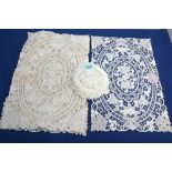 A set of eight needle-point place mats with set of matching smaller doilies, a set of six tape