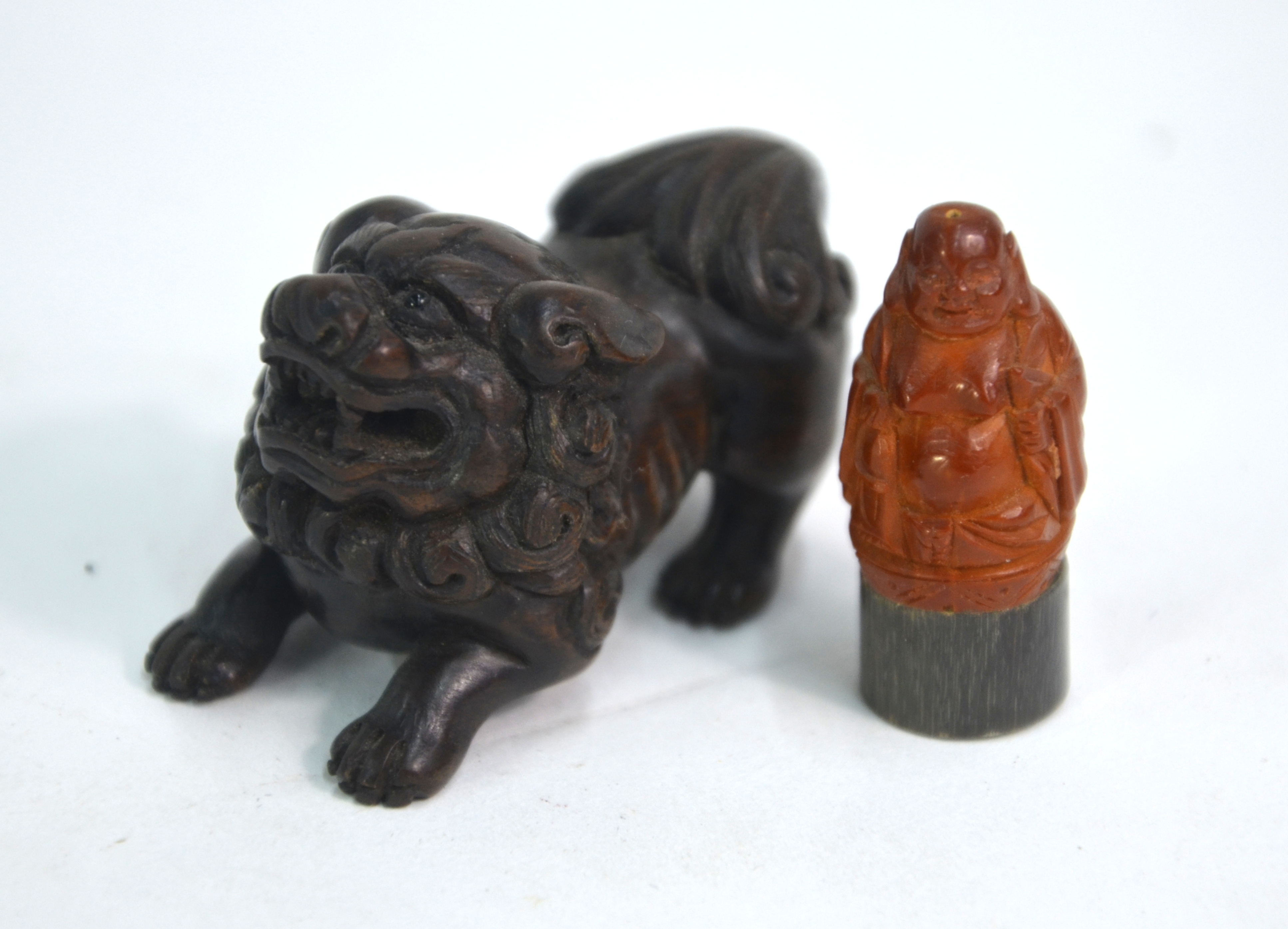 Six small cabinet or scholar's objects, comprising: a wood netsuke of a karashishi; a mottled - Image 5 of 7