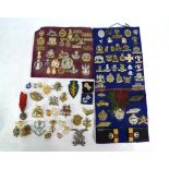 A collection of Military badges, including Tank Corps, Hussars, Lancers, Dragoons, Infantry, etc.,