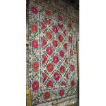 An antique Kerman Suzani, Uzbekistan, the six linen panels with silk floral and leaf design, mid/