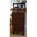 An antique mahogany book press, on four drawer chest, raised on shaped bracket feet