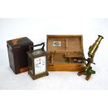 A small lacquered brass field microscope in fitted box and six 19th century prepared nature