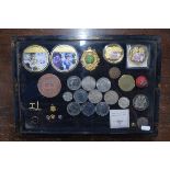 A Chinoiserie-decorated display case, containing various commemorative coins including five £5