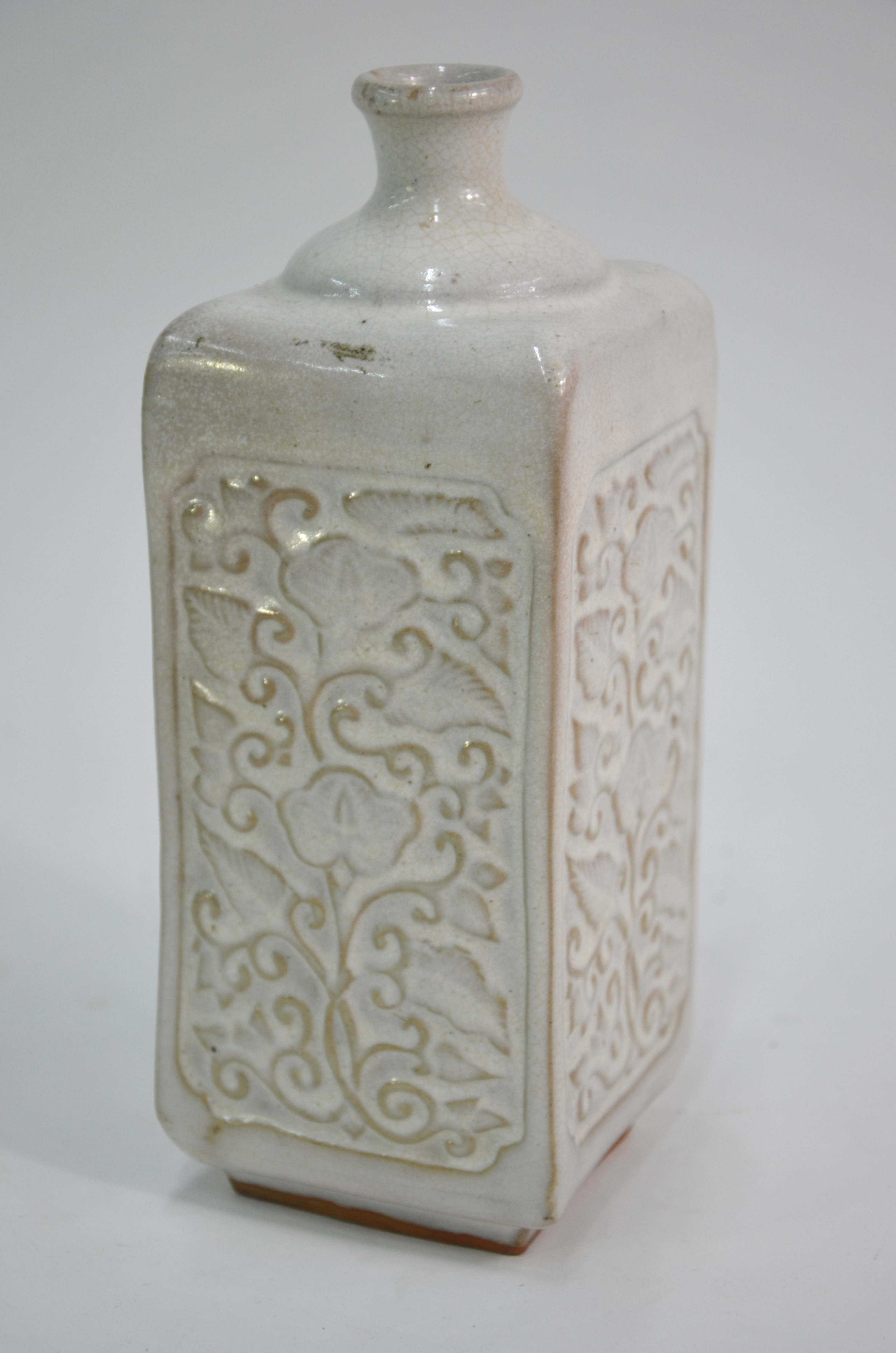 A cream-grey bottle vase of square section; decorated on each rectangular panel with carved floral - Image 3 of 7