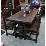A substantial Victorian oak draw leaf refectory dining table in the Elizabethan style, the three