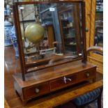 A 19th century satinwood edged mahogany toilet mirror, the rectangular swing plate over a three