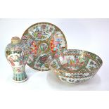 Four items of famille rose, comprising a circular Canton dish, 26 cm diameter, a Canton bowl, 26