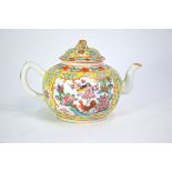 A Chinese yellow-ground, famille rose teapot and domed cover with gilt peach finial; decorated