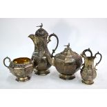 A good quality Victorian four piece tea service including hot water jug, octagonal melon and pear-
