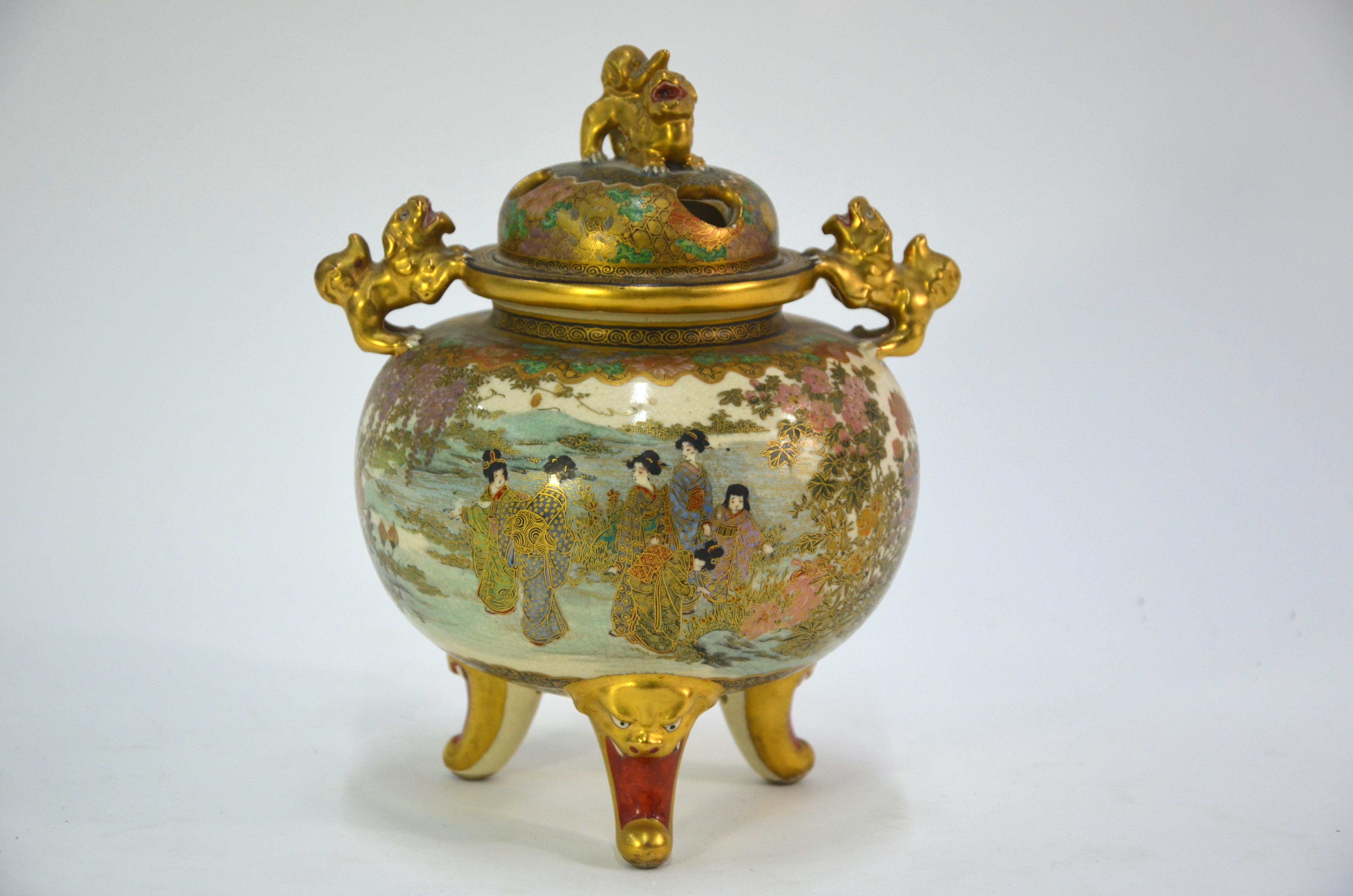 A Satsuma koro with pierced domed cover and karashishi finial; decorated in gilt and colours with