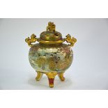 A Satsuma koro with pierced domed cover and karashishi finial; decorated in gilt and colours with