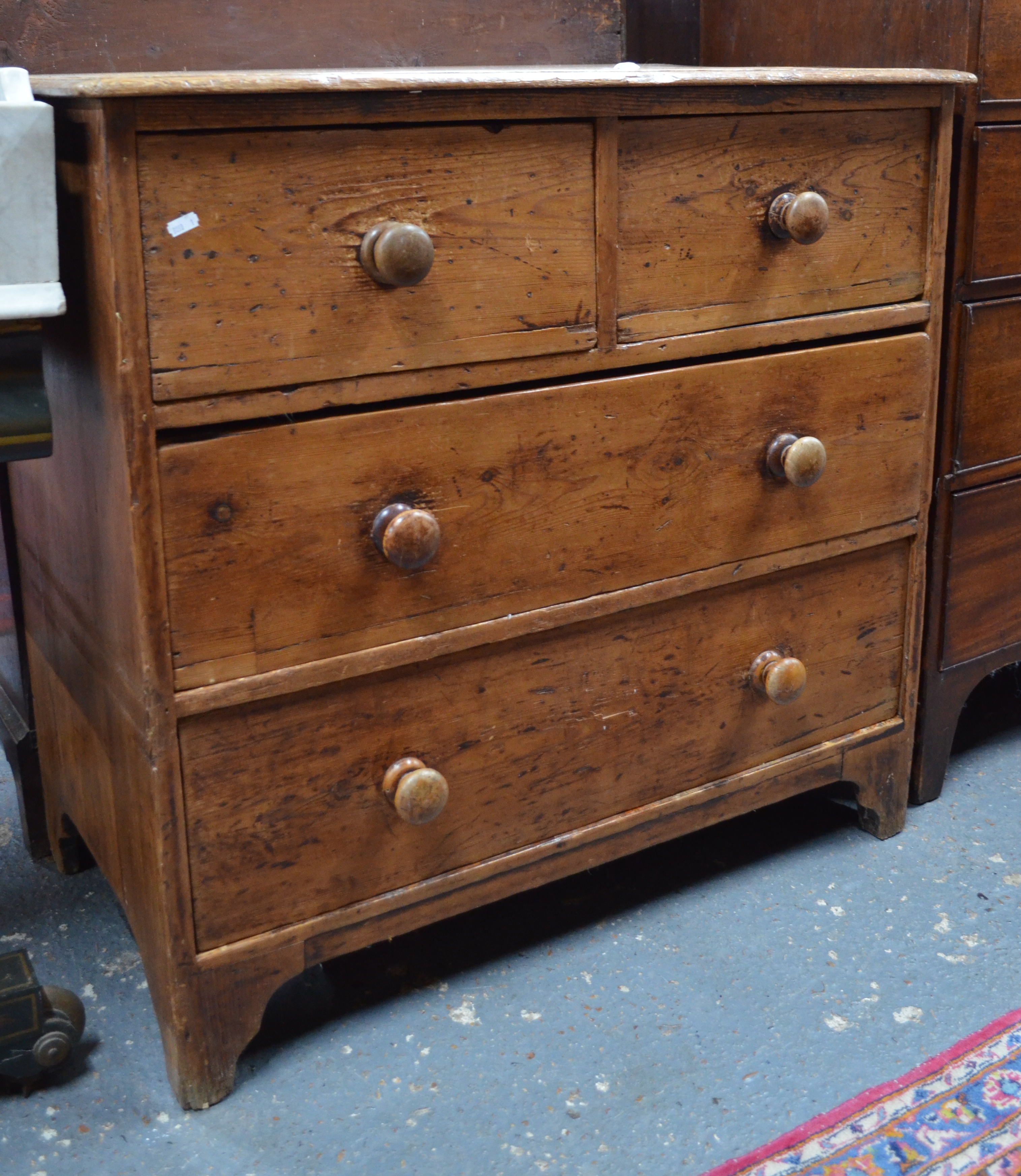 A Victorian waxed pine chest of two long over two short drawers, ex- Winchester College boarding