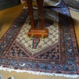 An old Persian Kurd rug, the lattice design centred by a lozenge medallion on camel ground, 180 x