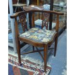 A late 19th century inlaid mahogany corner elbow chair with fabric seat pad, on square tapering legs