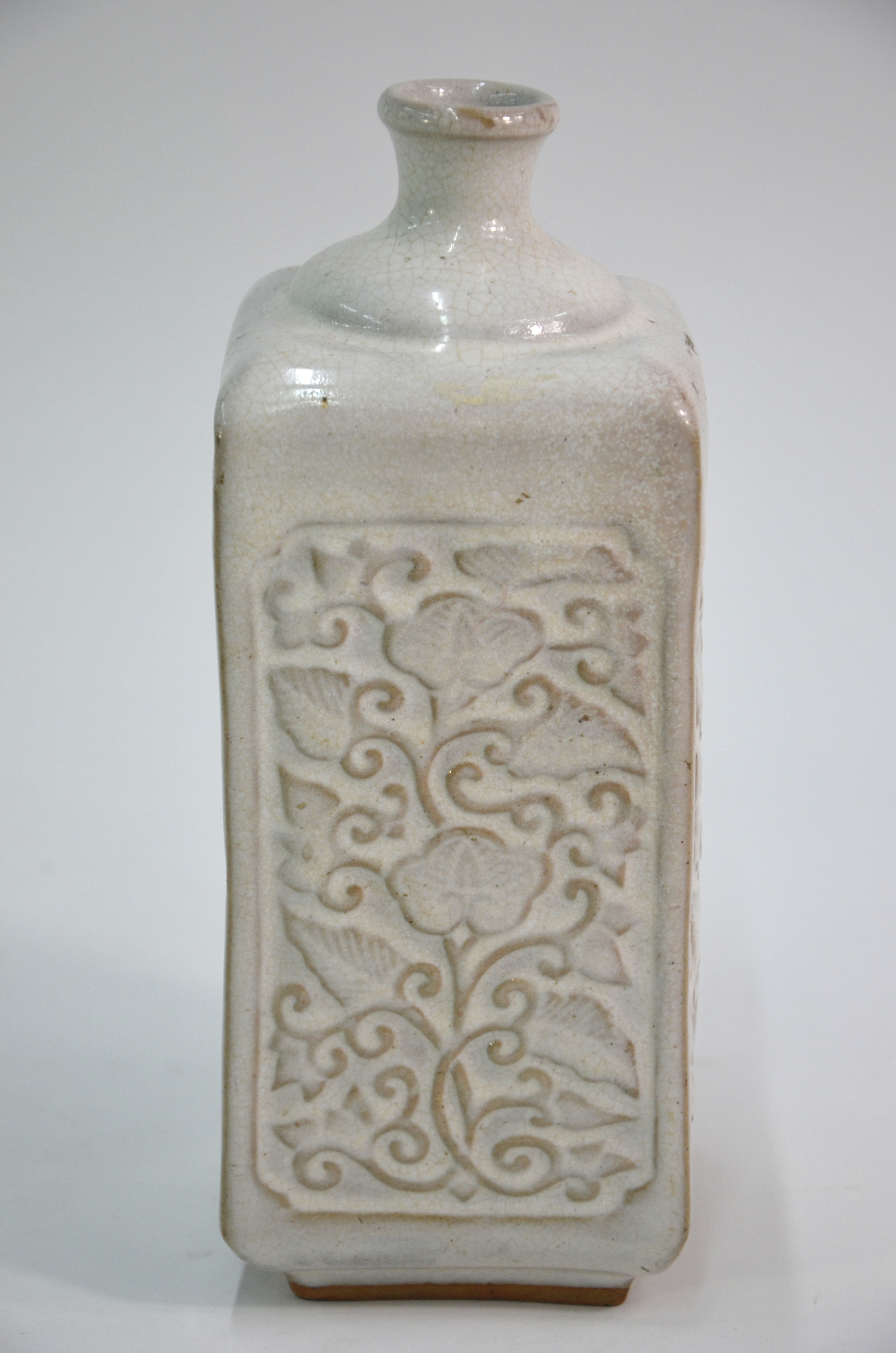 A cream-grey bottle vase of square section; decorated on each rectangular panel with carved floral - Image 2 of 7