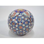 An Ottoman style, hanging ornament of spherical form, decorated with blue, orange and black