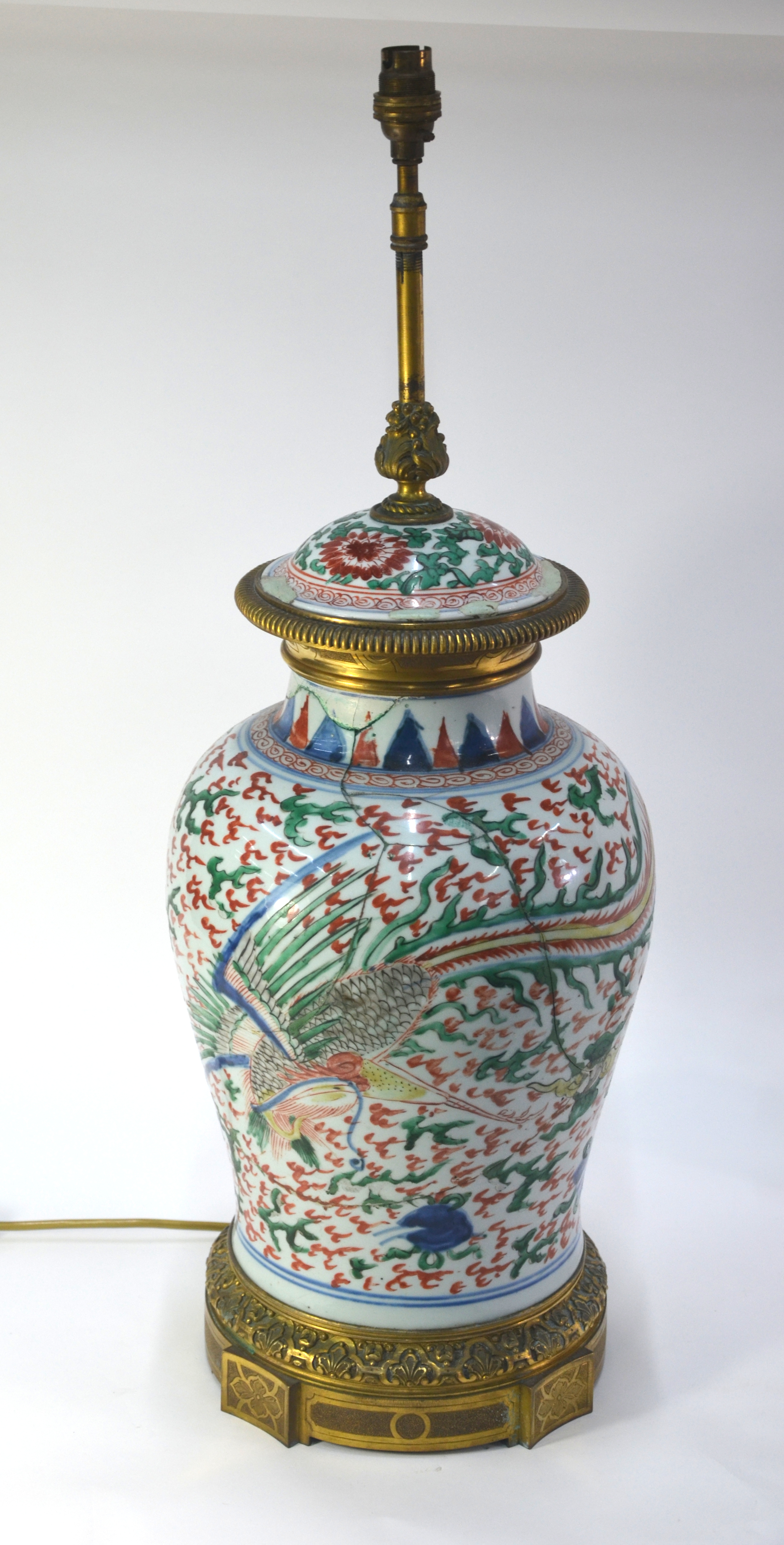 A wucai oviform vase, decorated in underglaze blue, aubergine, yellow, orange and green with a