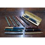 Thirteen various vintage pens and propelling pencils, including Sheaffer 'Snorkel' pen, Parkers,