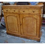 A Victorian satin-birch side cabinet, the moulded edge top over a pair of frieze drawers and