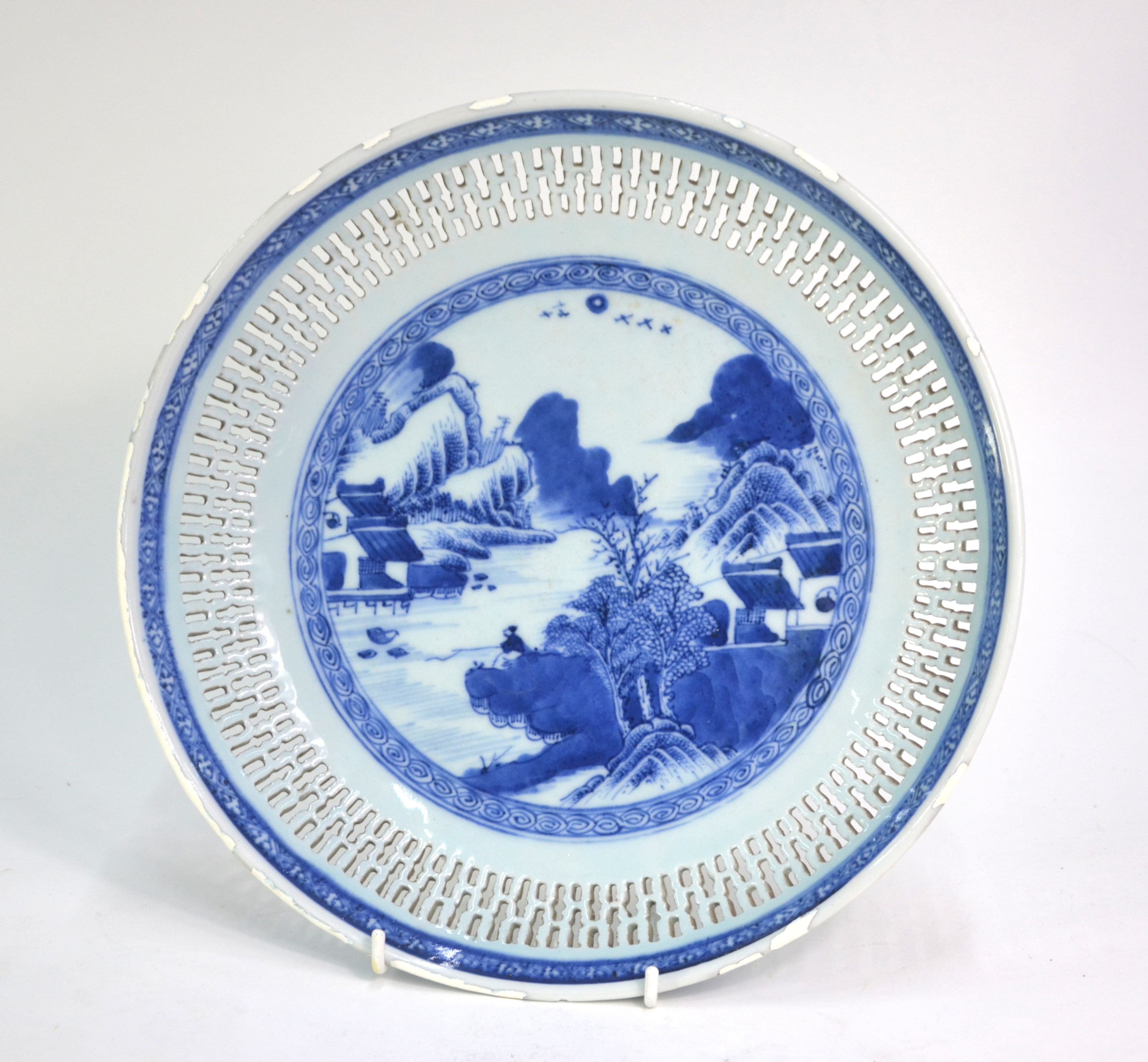 A blue and white dish of circular form with reticulated rim; decorated with a fisherman in a - Image 2 of 6