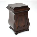 A Victorian rosewood pedestal cabinet, the hinged top over a cupboard, raised a bun feet, 36 x 38