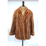 A shadowed musquash fur jacket, 55 cm across chest Worn to opening edges and pocket edges - has been