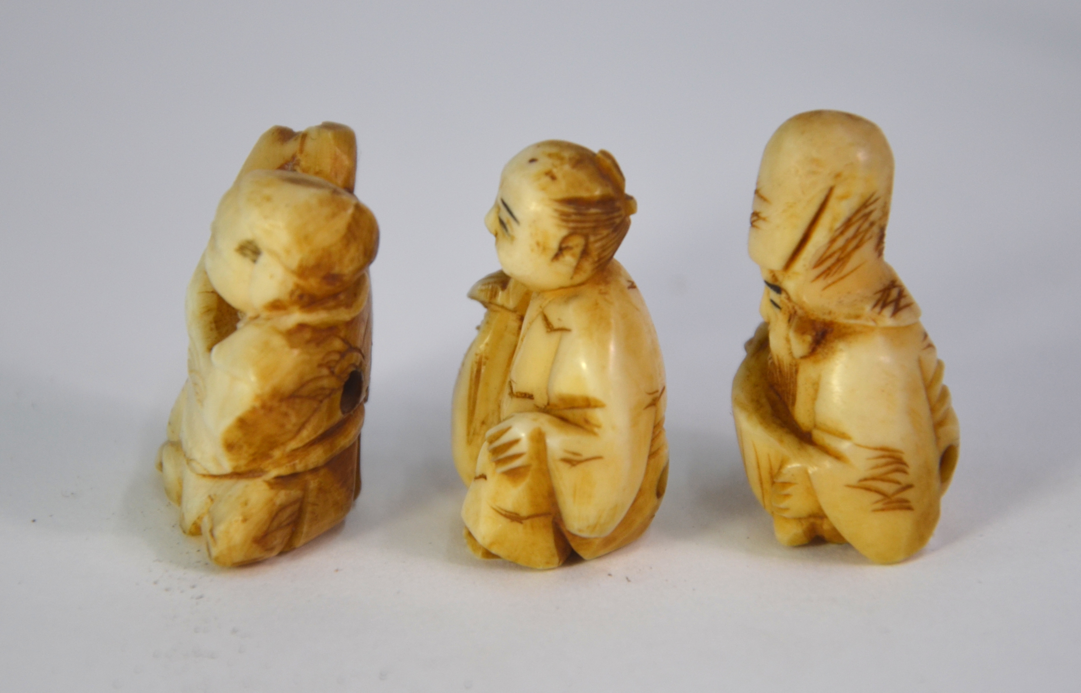 Seven ivory netsuke, including: one of Jurojin holding a makemono; and one of Gama Sennin holding - Image 3 of 9