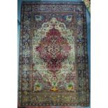 An antique Persian Isfahan rug, circa 1880, centred by a medallion with linked design on blue to