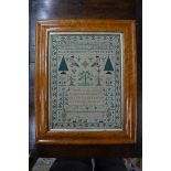 A George IV petit point and cross-stitch sampler worked with alphabets, numbers, flora, fauna and