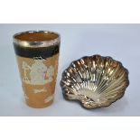 An Edwardian Royal Doulton stoneware harvest beaker with silver rim, London 1906, to/w a shell nut-