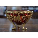 A late 19th century Continental gilt metal Art Nouveau sugar basin with ruby glass liner, with