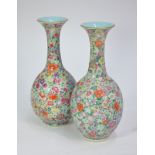 A pair of  Chinese famille rose, millefiori vases; each one decorated with typical dense floral