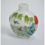 A famille rose Chinese snuff bottle decorated with a pair of birds and other animals in flight