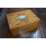 A Victorian walnut fitted work box and contents, including mother of pearl spools and reels,