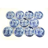 A set of eleven blue and white saucer dishes, each one decorated with the Sanxing as a metaphor