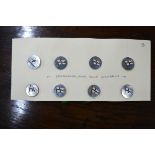 A set of eight Edwardian silver and enamel Royal Yacht Squadron buttons, decorated with the