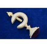 A Victorian carved ivory pin-cushion with table-clamp, 13 cm
