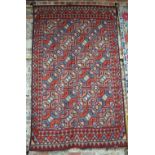 An old Laka Uzbek tribal kelim, N Afghanistan, the four rows of multi-coloured guls on red/brown