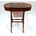 A Victorian rosewood work table, the D-end top with rising centre panel enclosing a fitted interior,