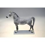 A Bing & Grondahl model of a dapple grey horse on a rectangular stand, backstamp '2271', 24 cm