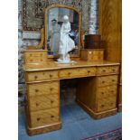 Heal & Son, London, a Victorian satin-birch mirror backed knee-hole dressing table, of inverted