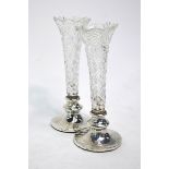 A pair of cut glass specimen flutes on loaded silver bases, Levi & Salaman, Birmingham 1905, 15 cm