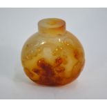 An agate Chinese snuff bottle, decorated with a scholar kneeling beneath a bat, 5.5 cm high Some