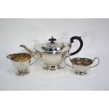 An electroplated half reeded 'Aladdin' three-piece tea service on stemmed foot rims