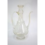 A tall Ottoman style glass ewer with curved spout and looped handle on a cylindrical base, 40 cm