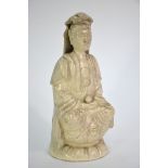 A blanc-de-chine style figure of Guanyin, the Bodhisattva of Mercy; seated in dhyanasana on a